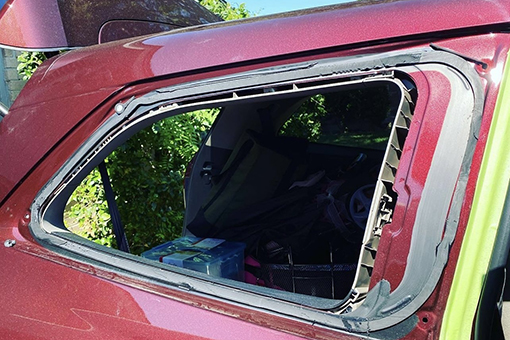 Car's Interior Visible Outside Due to Broken Window In Need of Auto Glass Repairs in Hillsborough County Florida