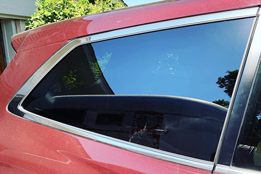 Side Window of Red Car Owned by Riverview Man Looking New After Receiving Car Window Repairs