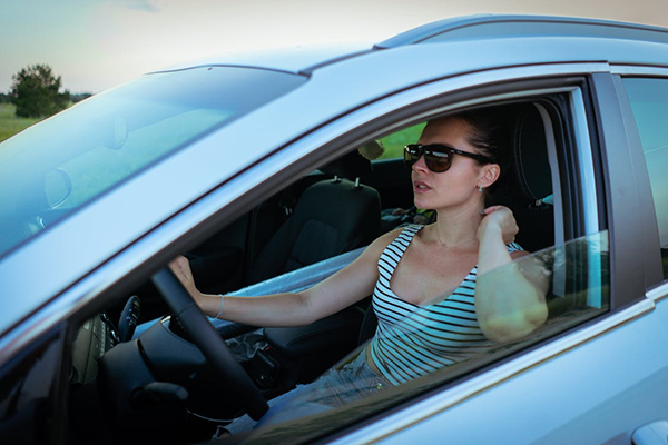 Lady Driver Seen Through a Stuck Car Window in Riverview Florida